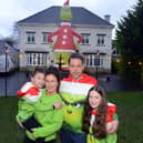 The Liddell family with their giant inflatable Grinch. Pictured are Ray and wife Jenna with daughters, from left, Jasmine, seven, and Olivia, 12.