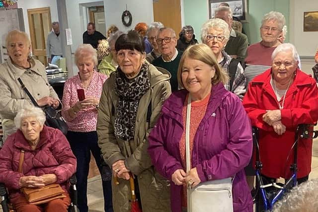 Residents, family members and guests gather for the the opening of the coffee shop at Hartfields. Picture by FRANK REID