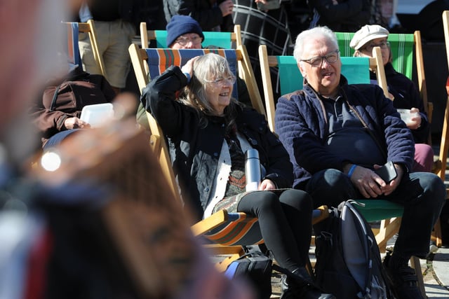 Visitors pulled up a deckchair and enjoyed the folk festival in the late summer sun.