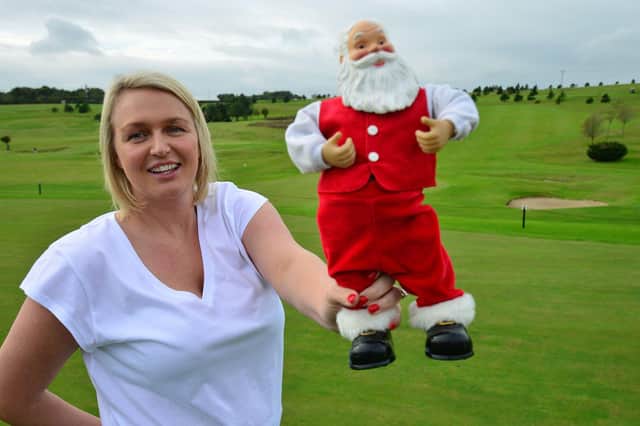 Kelly Forcer with Santa Clause as she is getting ready to set up the first Christmas market at High Throston Golf Club.