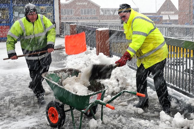 John Henderson (left) and Mick Cornforth clearing snow outside of the Middleton Grange Shopping Centre also from 2013. Picture by FRANK REID