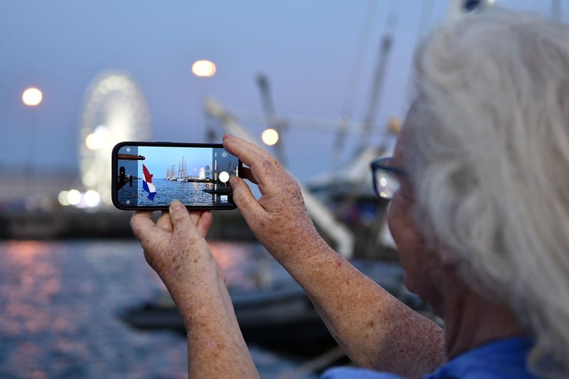 A visitor takes a photograph of the lights over the Victoria Dock during the Tall Ships in Hartlepool. Picture by BERNADETTE MALCOLMSON.
