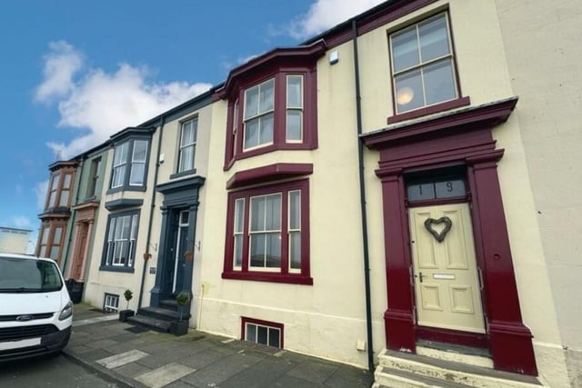 This three-storey house has four bedrooms , one bathroom and is within walking distance of the sea.
