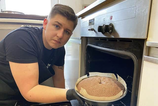 Josh Newton of Cake King Hartlepool taking a cake from the oven. Picture by FRANK REID