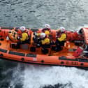 Hartlepool RNLI crew members set off to rescue two men after their kayak capsized.