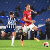 Nemanja Matic of Manchester United holds off Aaron Connelly of Brighton