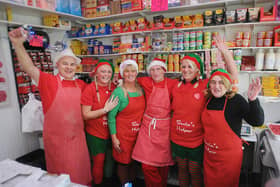 John Wilson (third from right) in his shop at Christmas in 2011 with staff John Hay, Angela Hornsey, Diane Whitfield, Clare Humphrey and Jackie Smith.
