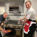 Cleveland Fire Brigade crew manager Gary Wilks, left, and watch manager Mark Poulsen showing how to cook safely.
