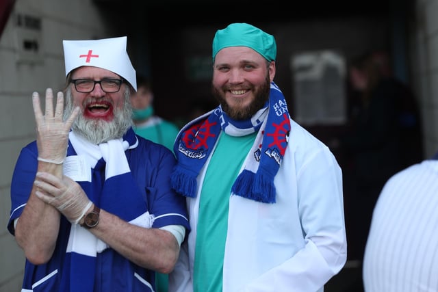 Some of the Hartlepool United supporters dressed as doctors at the Sands Venue Stadium. (Credit: Mark Fletcher | MI News)