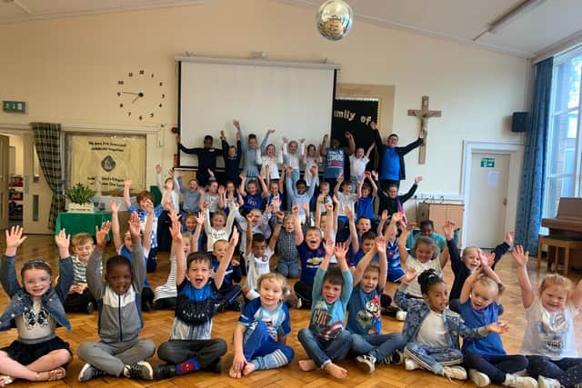 Pupils at St Joseph's Primary School celebrate Hartlepool United's promotion