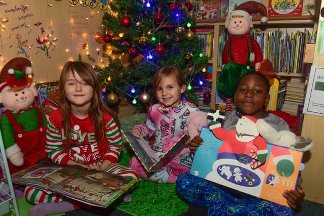 Bedtime stories at St. Aidan's school: Olivia Thorpe, Ivy Watts and Joshua Duru (left to right).