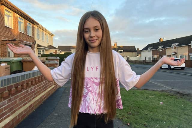 Isabelle McBean before having her hair cut off to donate to The Little Princess Trust.