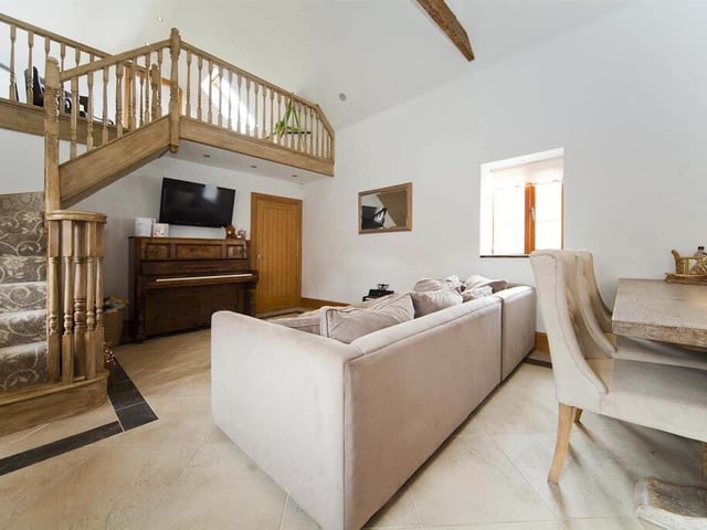 Next to the kitchen is an open plan snug and dining area, perfect for entertaining family and friends.