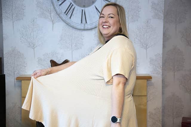 Zoe Barritt shows how much weight she has lost by trying on one of her old tops.