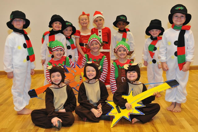 A snow family, Santa Claus, elves and a guitar-playing reindeer. What more could you want in a 2012 Nativity?