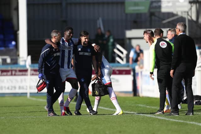 Hartlepool United's Mouhamed Niang is nearing the end of his concussion protocol after being forced off against Gillingham. (Credit: Mark Fletcher | MI News)