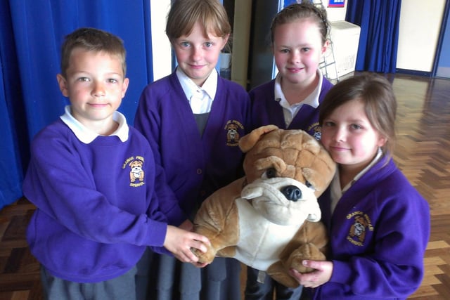Grange Primary School pupils raise money for charity, including Adam Stuart, Sophie McManus, Chloe Wilson and Leonie Taylor, who are pictured with their school mascot Hartley .