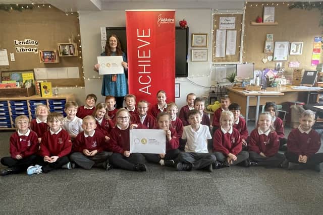 West View Primary School pupils celebrate their Artsmark Gold award with class teacher and art and design lead Rachael Johnson.