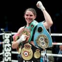 MANCHESTER, ENGLAND - JULY 01: Savannah Marshall poses for a photograph wearing her title belts whilst celebrating victory after defeating Franchon Crews-Dezurn during the IBF, WBA, WBC, WBO World Super Middleweight Title fight between Savannah Marshall and Franchon Crews-Dezurnat AO Arena on July 01, 2023 in Manchester, England. (Photo by Charlotte Tattersall/Getty Images)