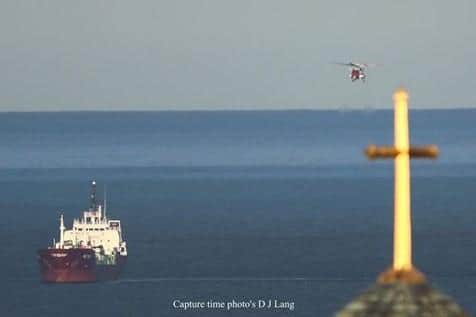 The Coastguard helicopter leaves the scene. Picture: Donald Lang.