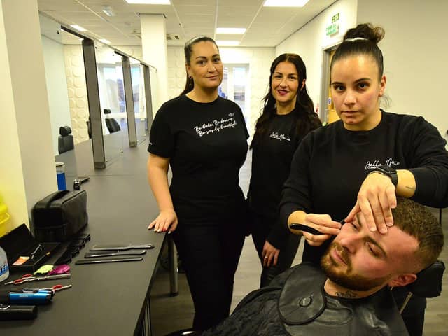 Gemma Lowery (left) and Amy McKenna Directors of Bella Man Training Academy Ltd look on as barbering assistant Gina Ioannou Shaves the face of barbering assistant Anthony Lupton Picture by FRANK REID