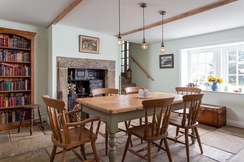 The main dining room has many characterful features, including a Yorkshire stone flagged floor, a feature stone fire place, and exposed beams, plus views over the open fields.