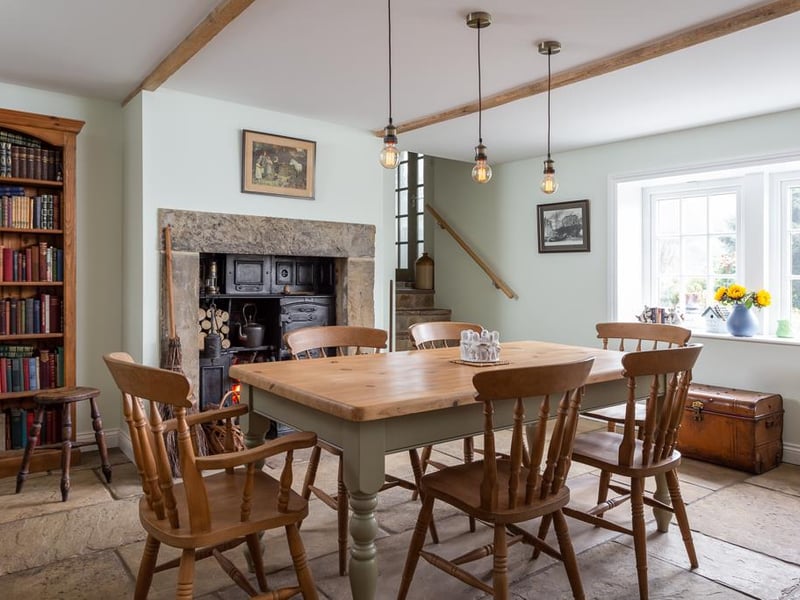 The main dining room has many characterful features, including a Yorkshire stone flagged floor, a feature stone fire place, and exposed beams, plus views over the open fields.