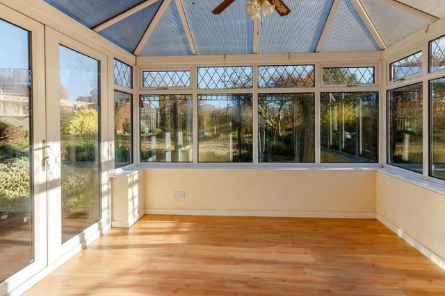 Added on to the bungalow is this bright conservatory. With a ceiling fan and light point, it has French doors leading outside to the back garden.