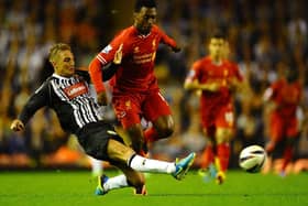 Gary Liddle of Notts County battles with Daniel Sturridge of Liverpool during the Capital One Cup Second Round between Liverpool and Notts County at Anfield on August 27, 2013 in Liverpool, England.  (Photo by Laurence Griffiths/Getty Images)