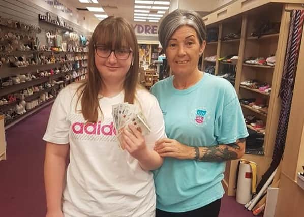 Elly Mae shows her thanks for all the support she and her family got from Miles for Men by handing over a donation to the Hartlepool charity.