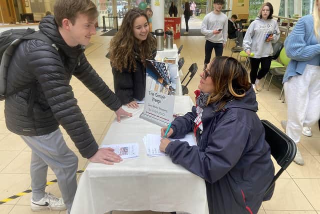 Hartlepool Sixth Form College students Harry Beadard and Sophia Cook talking with Lesley Mulcahy from The Simple Weigh during the Volunteer Fair. Picture by FRANK REID