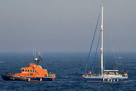 The all-weather lifeboat takes the yacht under tow