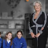 Former Hartlepool headteacher Julie Deville, right, with pupils in a photograph displayed in a London exhibition to celebrate teaching's Gallery of Greats.