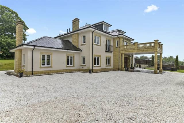 Front of property with carriage porch entrance.