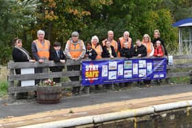 Golden Flatts teacher Clair Taylor, and pupils Advitha Trinity, Poppy, Eva, Kayleigh and Vinnie with Friends of Seaton Station members along with Marie Addison from Northern Rail.