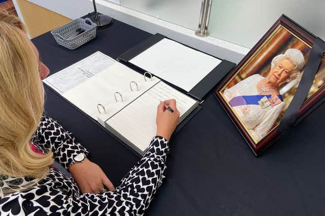 A member of the public signing the book of condolence in Hartlepool Civic Centre following the death of Her Majesty Queen Elizabeth II. Picture by FRANK REID