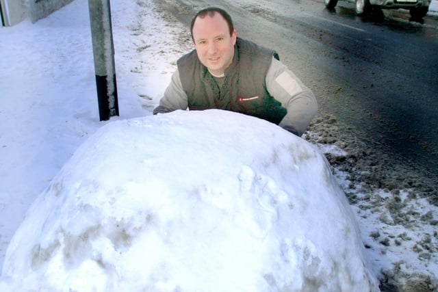 Kev Bate manoeuvres a giant snowball in Oxford Road in 2010.