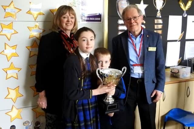 St Peter’s CE School, Elwick with their award. Left to right: President Carol Menabawey, pupils Heidi Mounter and Harrison Dignen, and Rotarian Roderick Thompson.
