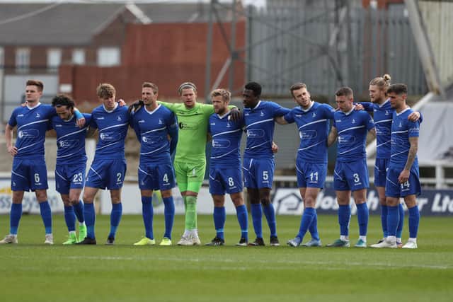 Hartlepool United's players observe a minute silence in remembrance of Lee Collins of Yeovil who died. Mark Fletcher | MI News & Sport Ltd