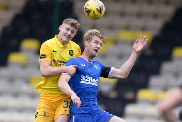 Jack Hamilton of Livingston  battles for possession with Filip Helander of Rangers FC  during the Ladbrokes Scottish Premiership match between Livingston and Rangers at Tony Macaroni Arena on August 16, 2020 in Livingston, Scotland. (Photo by Willie Vass/Pool via Getty Images)