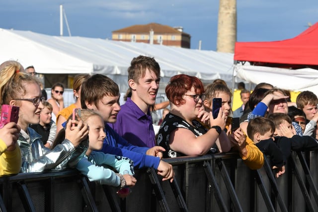 Fans watch Michael Rice on stage at the 2019 festival.