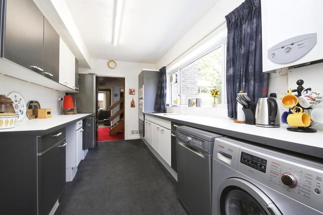 The kitchen is fitted with an range of appliances.