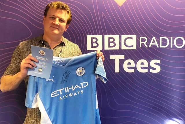 BBC Tees Radio presenter Paul Gough with the Manchester City shirt signed by Jack Grealish.