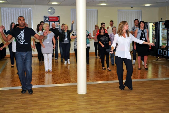 Strictly's 2005 finalist Colin Jackson on the dance floor in 2013 with former show favourite Erin Boag. And they are dancing with NPower Peterlee staff.