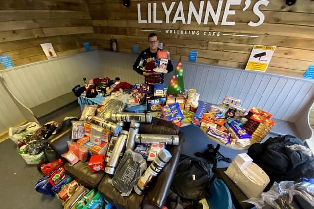 Trevor Sherwood inside LilyAnne's Wellbeing with items that have been donated by Tata Steel and Middlesbrough Jobcentre.