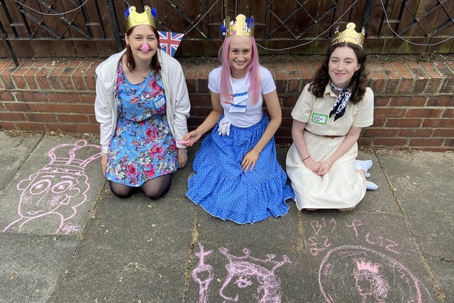 Grace Cooper, Jess Lowry and Chloe McKenna look the part in their crowns while drawing chalk pictures of the Queen during celebrations in Cresswell Road, Hartlepool on Sunday. Picture by FRANk REID