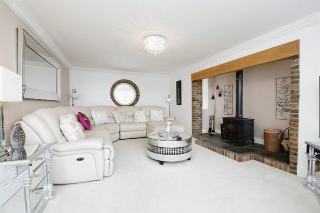 The open feature fireplace adds a cosy feel to the living room.