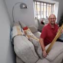 Colin Renshaw with his 2012 Olympic Torch, which takes pride of place in the lounge of his new Wingate home.