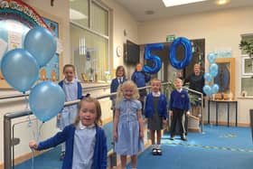 Headteacher Jane Dolphin and St Bega's pupils celebrate the school's 50th birthday.