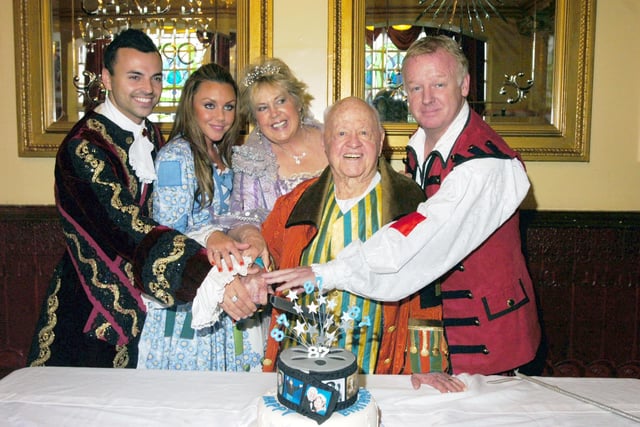 Screen legend Mickey Rooney, second right, celebrates his 87th birthday in 2007 while playing Barron Hardup at Sunderland Empire's Cinderella pantomime.